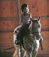 Child Riding a Horse